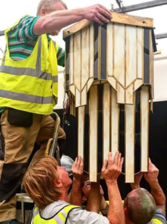 People working on a chandelier